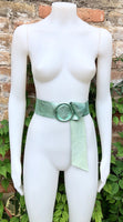 Metallic mint green leather waist belt with large round buckle. Soft leather belt in light aqua green.. Green wide waist belt