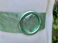 Metallic mint green leather waist belt with large round buckle. Soft leather belt in light aqua green.. Green wide waist belt