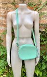 Small leather bag in aqua green. GENUINE leather cross body / shoulder bag. Light turquoise green purse. Tassel on the zipper. Gold accents.