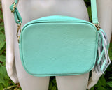 Small leather bag in aqua green. GENUINE leather cross body / shoulder bag. Light turquoise green purse. Tassel on the zipper. Gold accents.