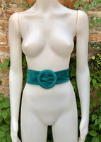 Dark turquoise suede waist belt with large round buckle.Boho soft suede belt in a light teal shade. Genuine natural blue-green suede leather