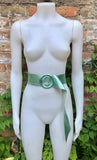 Metallic mint green leather waist belt with large round buckle. Soft leather belt in light aqua green.. Green wide waist belt