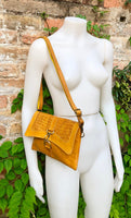 Small cross body bag in yellow “distressed” vintage style genuine leather. Enveloppe bag with adjustable strap and flap. Boho yellow purse