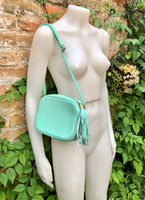 Small leather bag in aqua green. GENUINE leather cross body / shoulder bag. Light turquoise green purse. Tassel on the zipper. Gold accents.