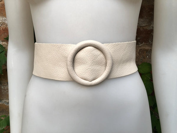 Cream leather waist belt with large round buckle. Soft leather belt in broken white. Genuine leather dress belt. Light beige wide waist belt