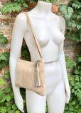 Light beige suede leather bag. GENUINE leather small crossbody / shoulder bag.Adjustable strap + zipper. Cream suede purse with tassel.