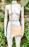 Light beige suede leather bag. GENUINE leather small crossbody / shoulder bag.Adjustable strap + zipper. Cream suede purse with tassel.