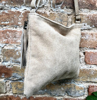 Light beige suede leather bag. GENUINE leather small crossbody / shoulder bag.Adjustable strap + zipper. Cream suede purse with tassel.