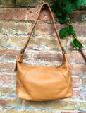 Small camel brown genuine leather bag. Light brown cross body / shoulder bag. Tan leather purse, 2 adjustable straps, closed with a zipper.