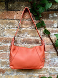 ORANGE genuine leather bag. Cross body / shoulder pumkin color leather purse, 2 adjustable straps, longer + shorter. Closed with a zipper.