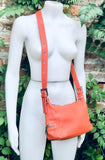 ORANGE genuine leather bag. Cross body / shoulder pumkin color leather purse, 2 adjustable straps, longer + shorter. Closed with a zipper.