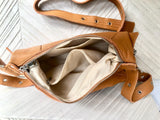 Small camel brown genuine leather bag. Light brown cross body / shoulder bag. Tan leather purse, 2 adjustable straps, closed with a zipper.