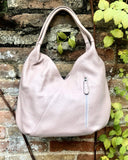 LIGHT PINK genuine leather bag. Pink shoulder bag closed with a zipper. Several pockets.