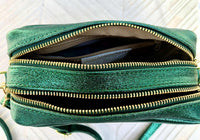 Small leather bag in metallic green. Genuine leather cross body / shoulder bag. Dark green glitter purse. Adjustable strap. Gold accents