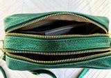 Small leather bag in metallic green. Genuine leather cross body / shoulder bag. Dark green glitter purse. Adjustable strap. Gold accents