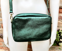 Small leather bag in metallic green. Genuine leather cross body / shoulder bag. Dark green glitter purse. Adjustable strap. Gold accents
