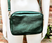 Small leather bag in metallic green. Genuine leather cross body / shoulder bag. Dark green glitter purse. Adjustable strap. Gold accents