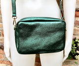 Small leather bag in metallic green. Genuine leather cross body / shoulder bag. Dark green glitter purse. Adjustable strap. Gold accents
