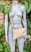 Small leather bag in CREAM WHITE. Crossbody / shoulder bag/ wristlet in GENUINE leather. Adjustable strap and zipper. Broken white purse.