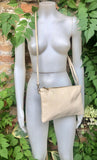 Small leather bag in CREAM WHITE. Crossbody / shoulder bag/ wristlet in GENUINE leather. Adjustable strap and zipper. Broken white purse.