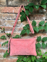 SALMON pink suede leather bag. GENUINE leather small crossbody / shoulder bag. Adjustable strap + zipper. Light pink suede purse with tacks.