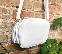 Small leather bag in white. Crossbody / shoulder bag in white GENUINE leather. Adjustable strap, zipper. White leather purse with tassel.
