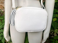 Small leather bag in white. Crossbody / shoulder bag in white GENUINE leather. Adjustable strap, zipper. White leather purse with tassel.