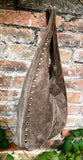 Slouch bag in TAUPE brown with bronze tacks and zipper. Genuine leather bag. Light BROWN color lined bag. Greyge brown suede purse.