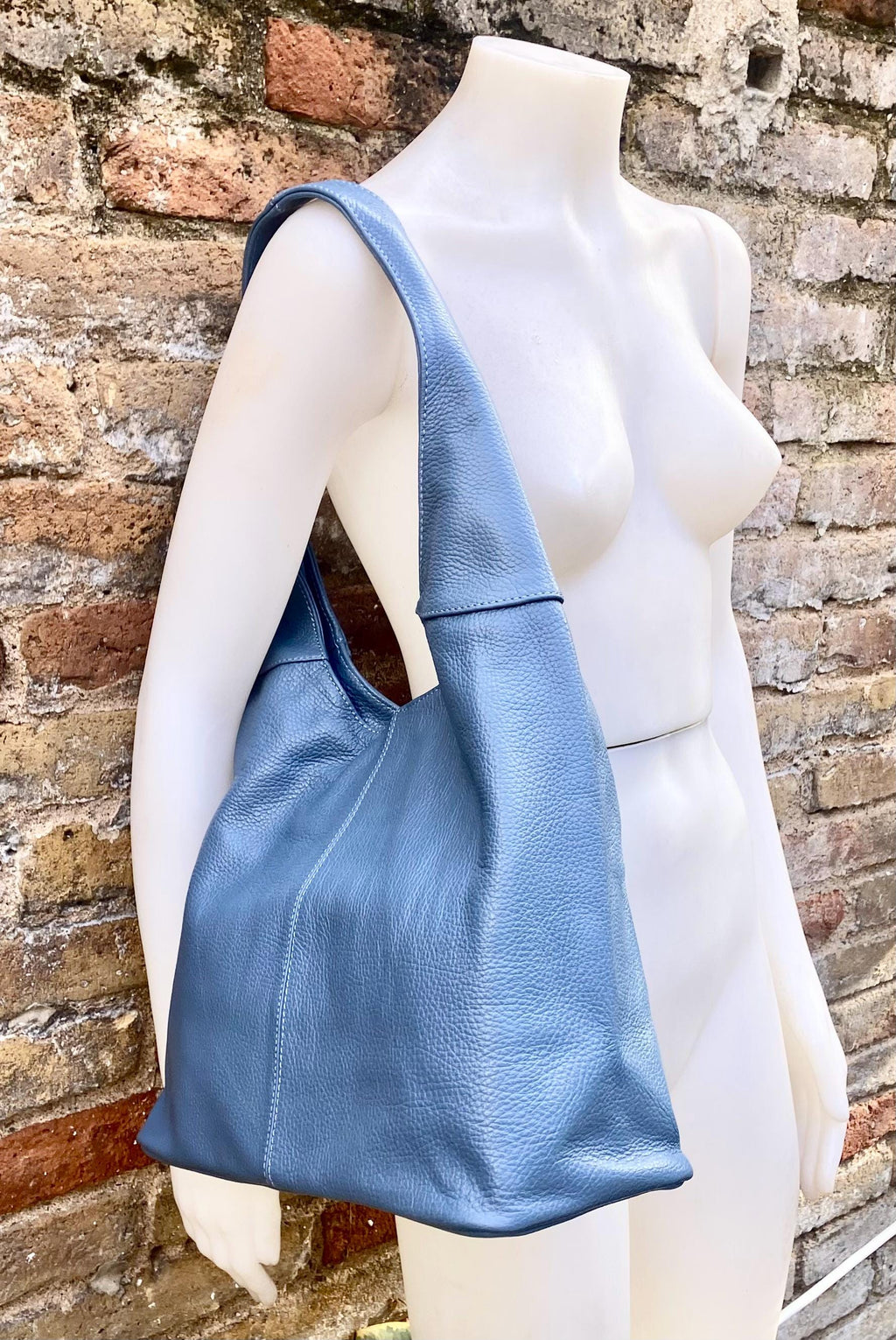 Blue genuine leather shoulder bag. Blue - gray slouchy bag. Wide strap, lined closed with a zipper. Denim blue leather shopper.