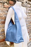 Blue genuine leather shoulder bag. Blue - gray slouchy bag. Wide strap, lined closed with a zipper. Denim blue leather shopper.