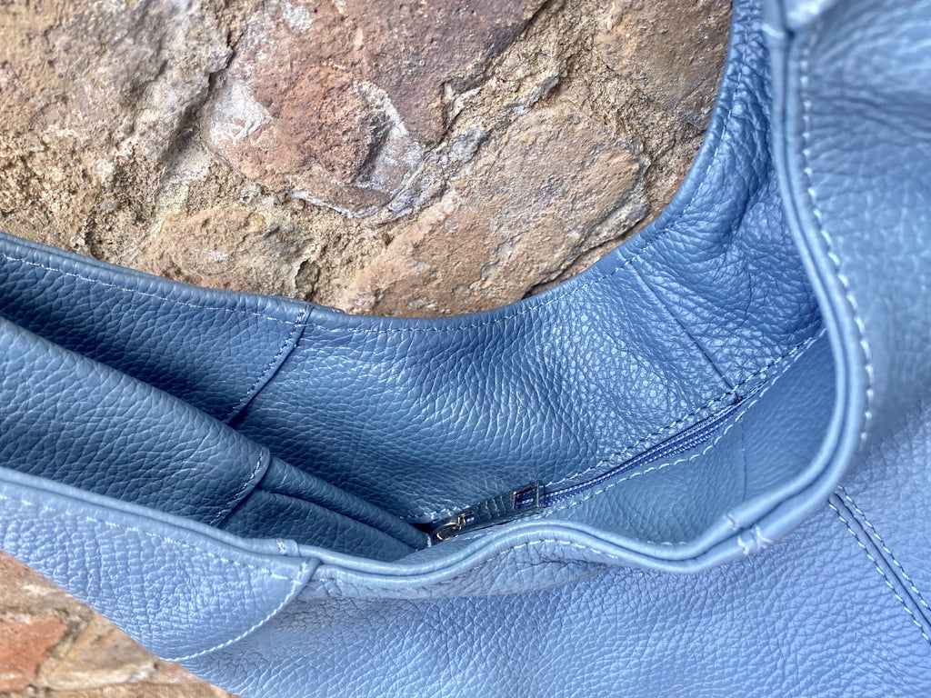 Blue genuine leather shoulder bag. Blue - gray slouchy bag. Wide strap, lined closed with a zipper. Denim blue leather shopper.