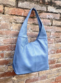 Blue genuine leather shoulder bag. Blue - gray slouchy bag. Wide strap, lined closed with a zipper. Denim blue leather shopper.