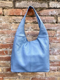Blue genuine leather shoulder bag. Blue - gray slouchy bag. Wide strap, lined closed with a zipper. Denim blue leather shopper.