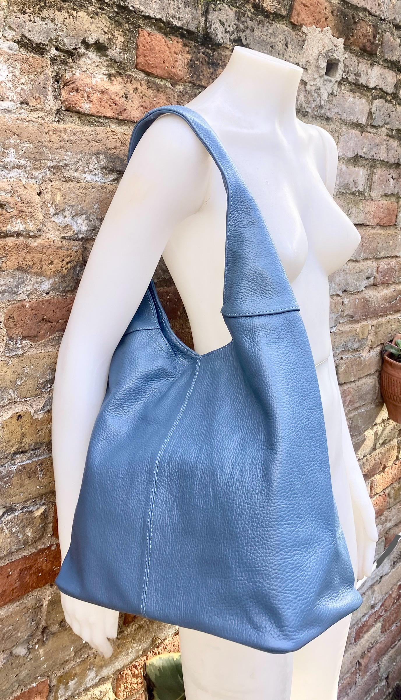 Blue genuine leather shoulder bag. Blue - gray slouchy bag. Wide strap, lined closed with a zipper. Denim blue leather shopper.