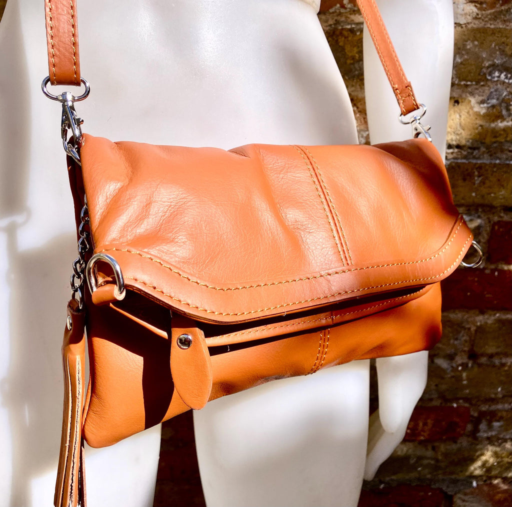 Small leather bag in light camel brown. GENUINE leather crossbody/shoulder bag. Tan brown bag with adjustable strap, zipper and flap.