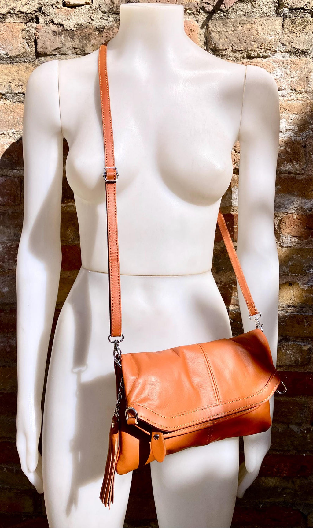 Small leather bag in light camel brown. GENUINE leather crossbody/shoulder bag. Tan brown bag with adjustable strap, zipper and flap.