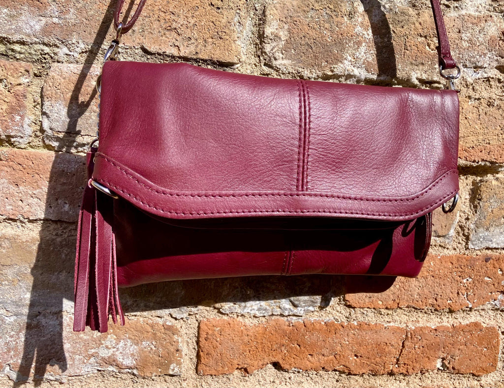 Small leather bag in burgundy. GENUINE leather cross body / shoulder bag in wine red with adjustable strap, zipper and flap.