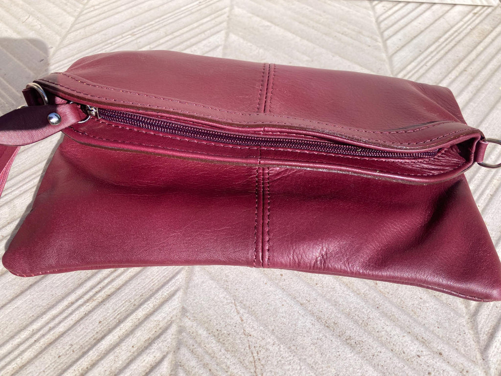 Small leather bag in burgundy. GENUINE leather cross body / shoulder bag in wine red with adjustable strap, zipper and flap.