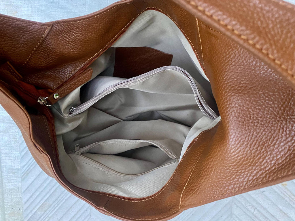 Camel brown slouch leather bag . Lined shoulder leather bag with wide strap and zipper. Large brown GENUINE leather purse. Brown shopper bag