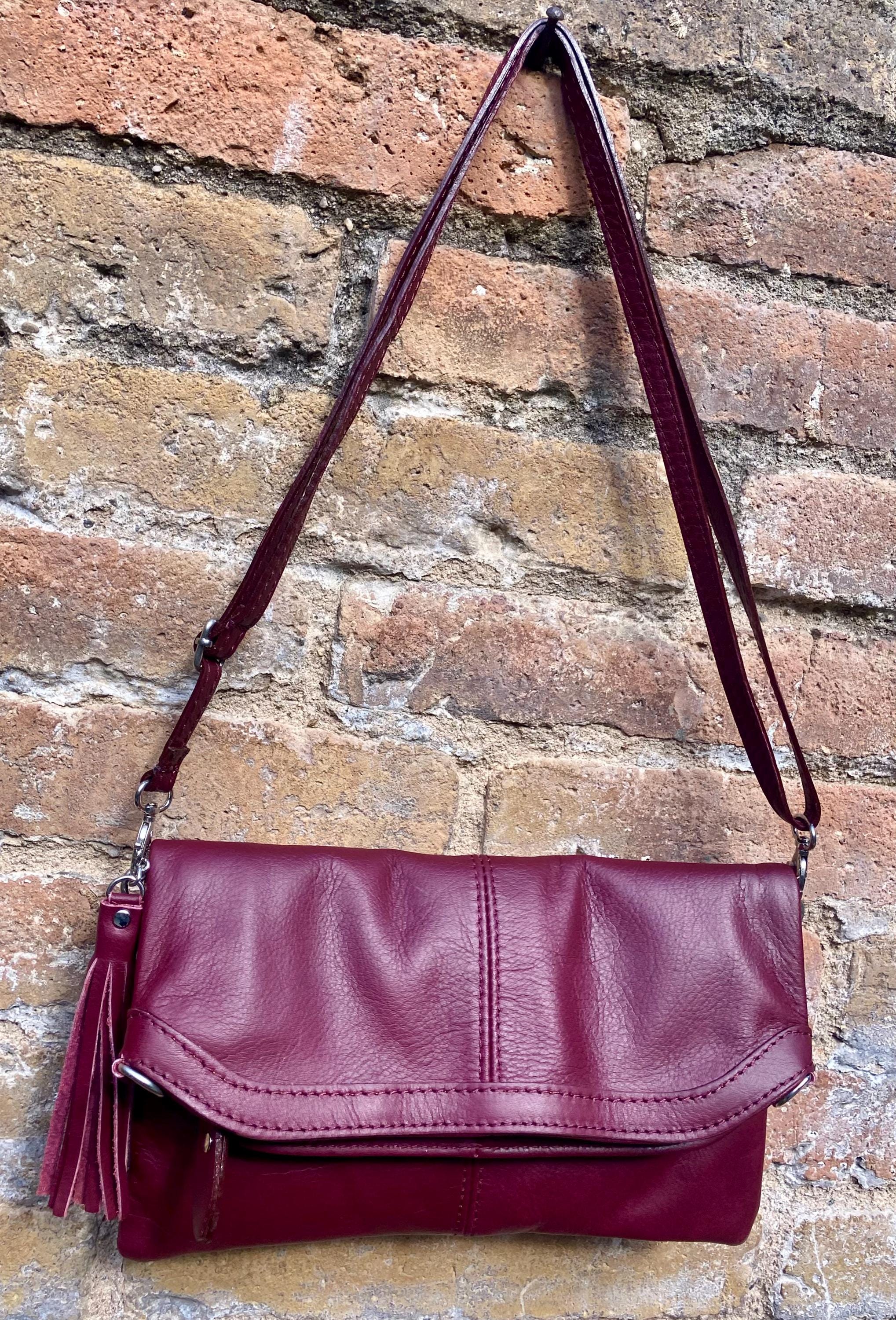 Small leather bag in burgundy. GENUINE leather cross body / shoulder bag in wine red with adjustable strap, zipper and flap.