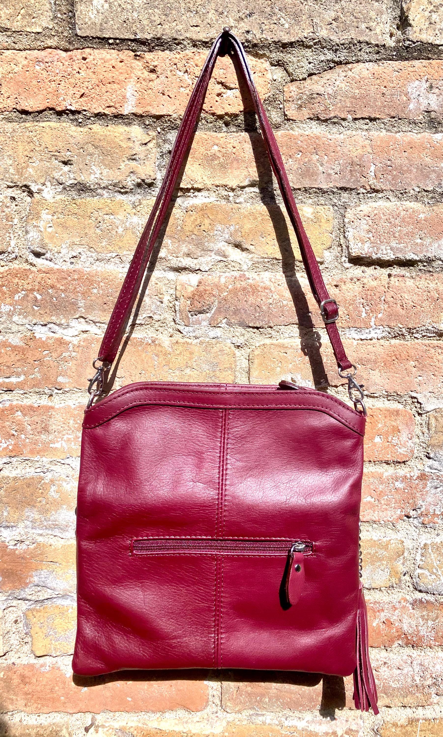Small leather bag in burgundy. GENUINE leather cross body / shoulder bag in wine red with adjustable strap, zipper and flap.