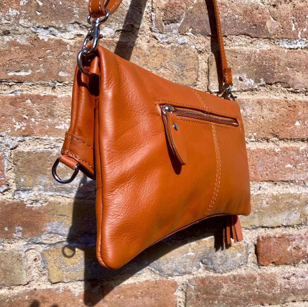 Small leather bag in light camel brown. GENUINE leather crossbody/shoulder bag. Tan brown bag with adjustable strap, zipper and flap.
