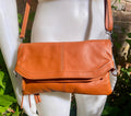 Small leather bag in light camel brown. GENUINE leather crossbody/shoulder bag. Tan brown bag with adjustable strap, zipper and flap.