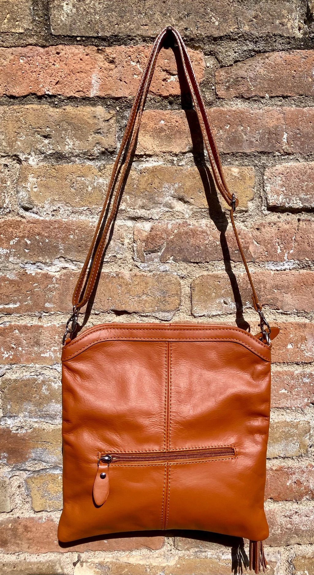 Small leather bag in light camel brown. GENUINE leather crossbody/shoulder bag. Tan brown bag with adjustable strap, zipper and flap.