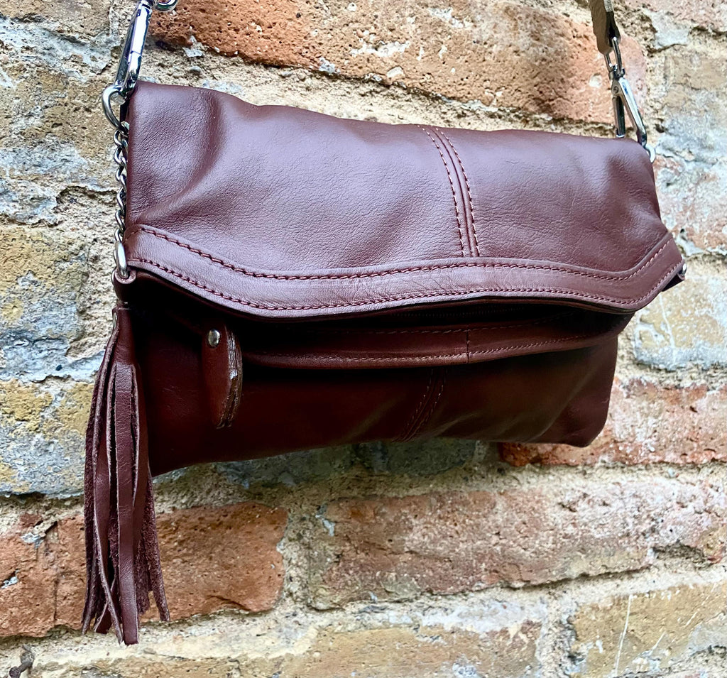 Small leather bag in dark brown. GENUINE leather crossbody/shoulder bag. Adjustable"guitar" strap, zipper and flap. Brown leather purse.