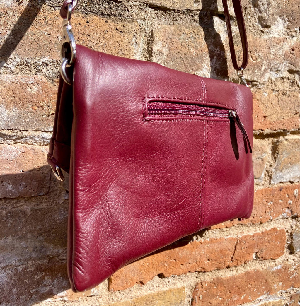 Small leather bag in burgundy. GENUINE leather cross body / shoulder bag in wine red with adjustable strap, zipper and flap.