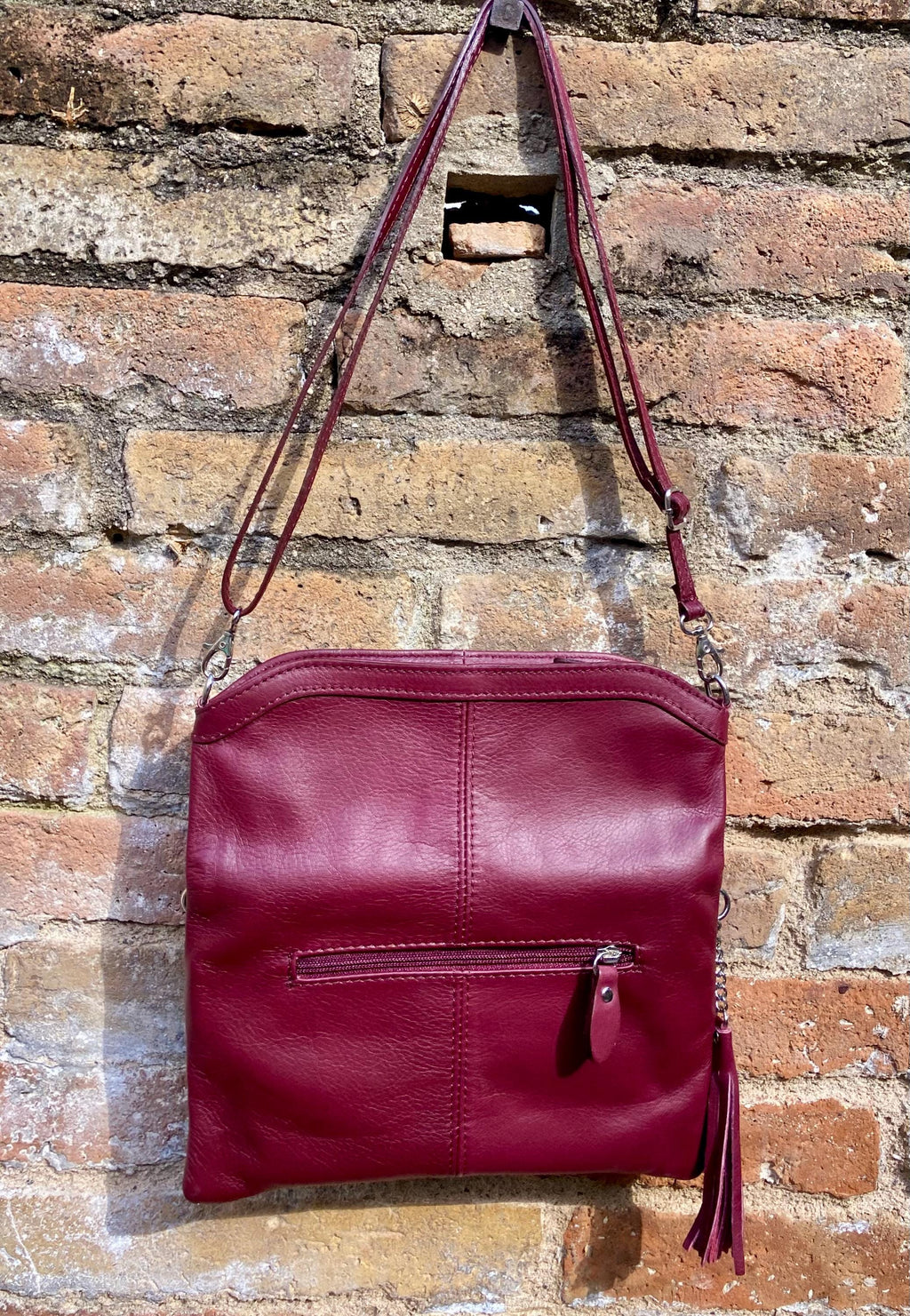 Small leather bag in burgundy. GENUINE leather cross body / shoulder bag in wine red with adjustable strap, zipper and flap.