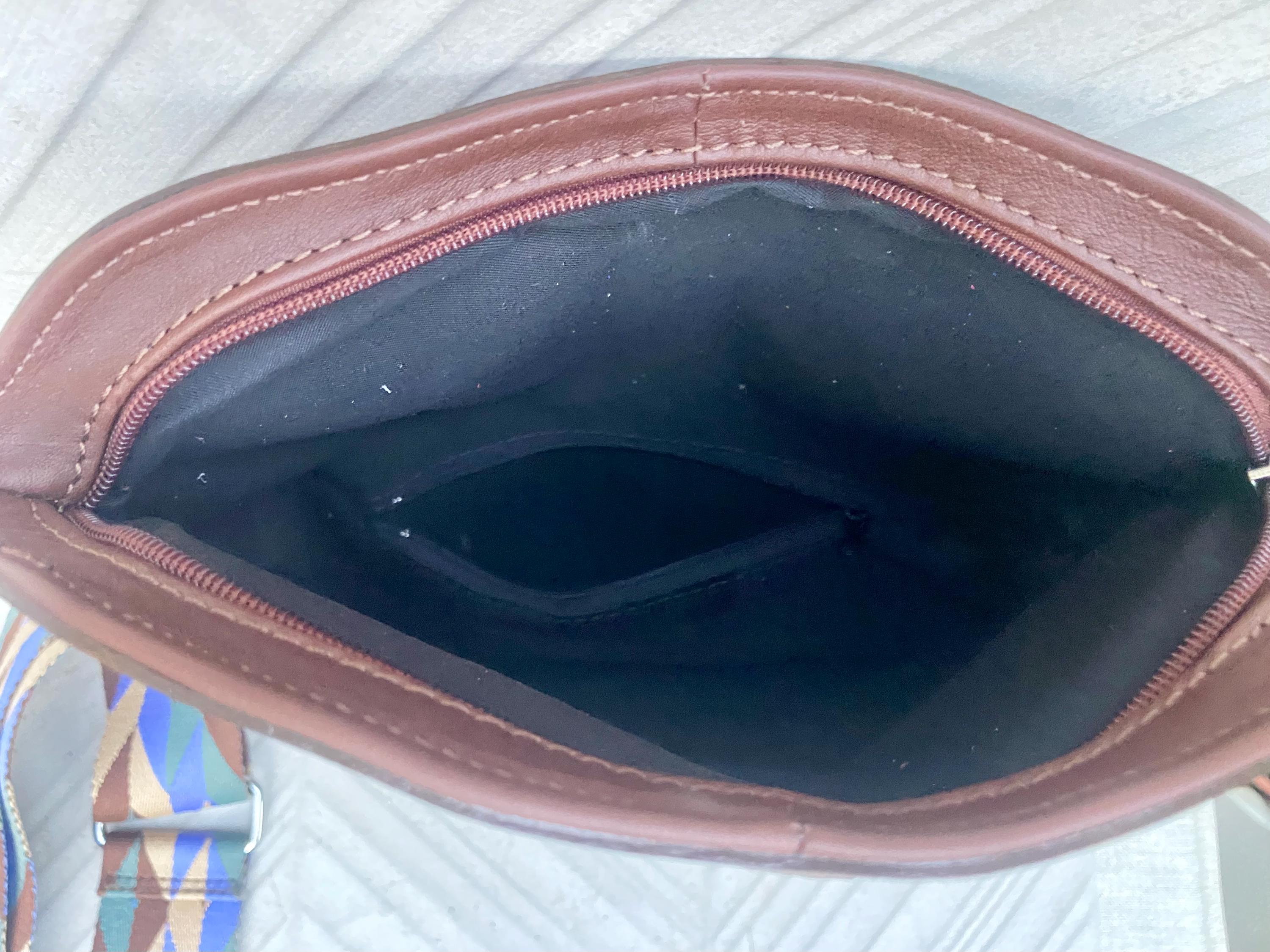 Small leather bag in dark brown. GENUINE leather crossbody/shoulder bag. Adjustable"guitar" strap, zipper and flap. Brown leather purse.
