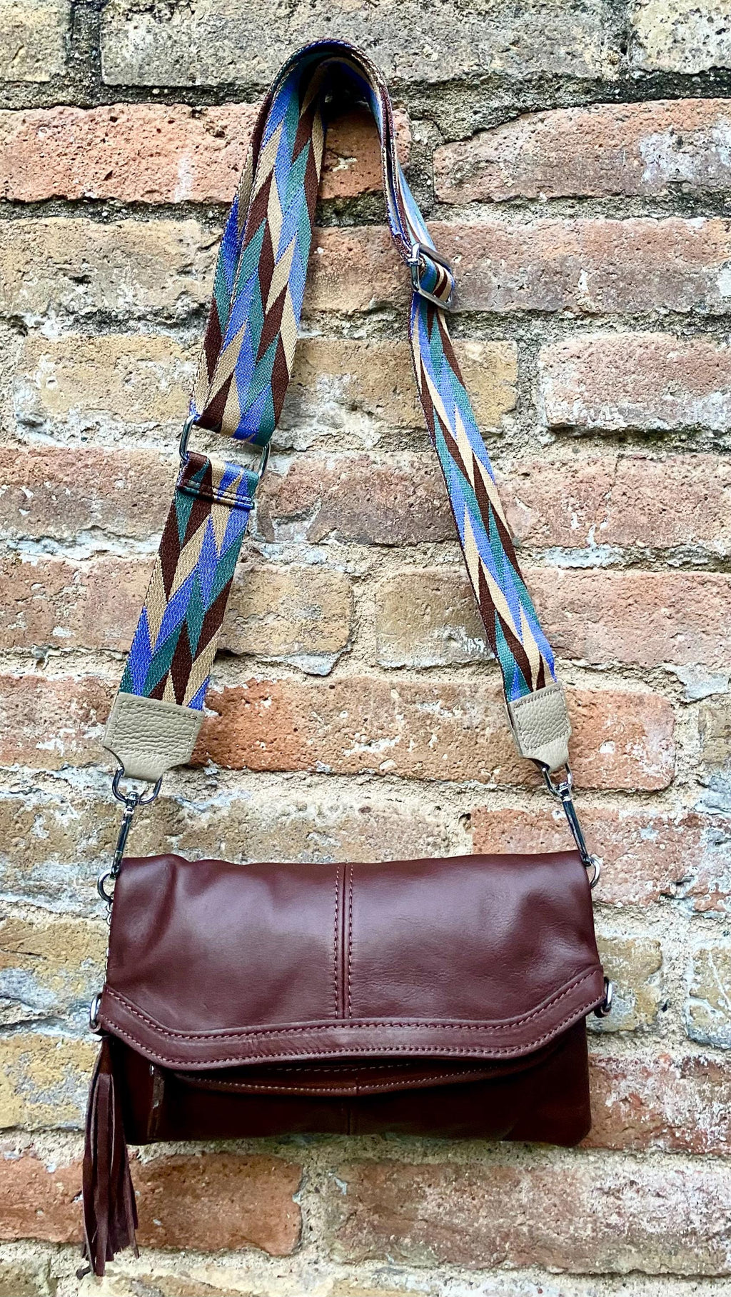 Small leather bag in dark brown. GENUINE leather crossbody/shoulder bag. Adjustable"guitar" strap, zipper and flap. Brown leather purse.