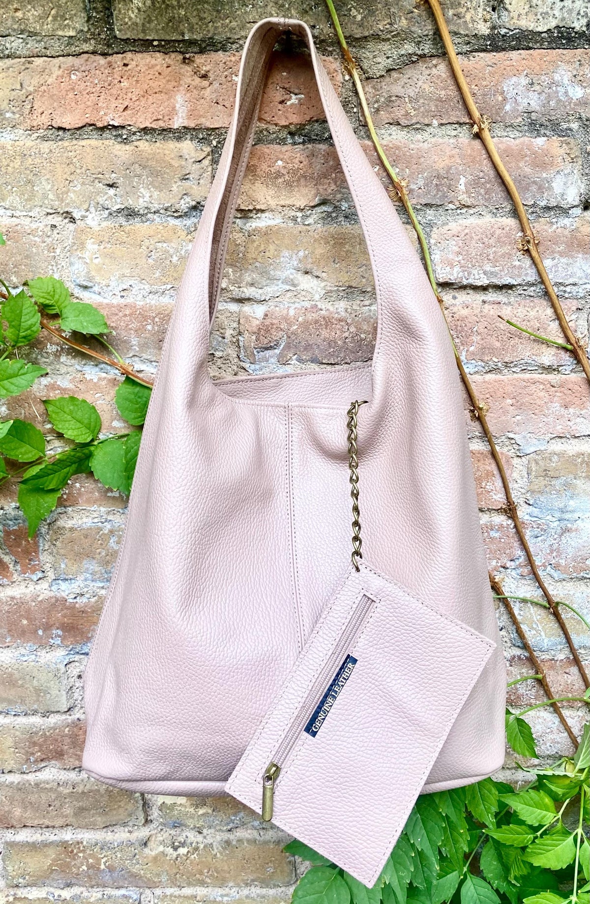 Light purple - pink slouchy leather bag. Soft genunine leather shopper with zipper at the top. Wide strap pink leather shoulder bag.
